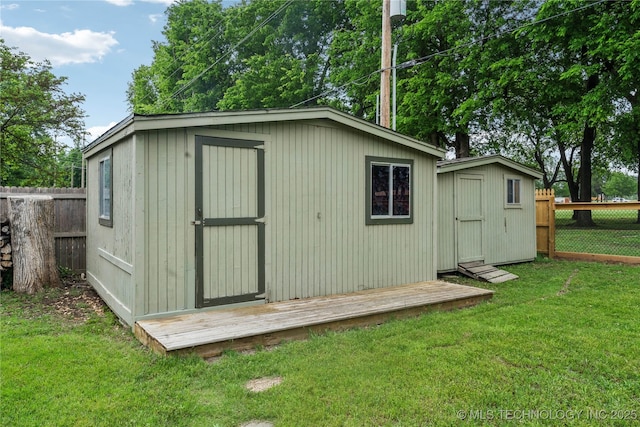 view of shed with a fenced backyard