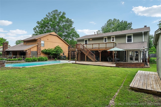 back of property featuring french doors, a wooden deck, stairway, a fenced backyard, and a yard