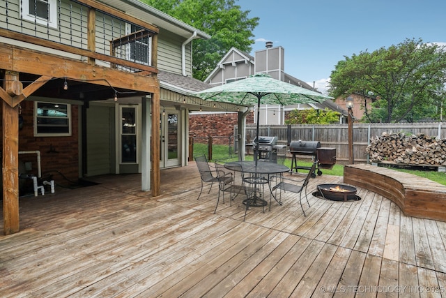 6605 S 1st St, Broken Arrow, OK 74012 - deck with an outdoor fire pit, grilling area, and outdoor dining space