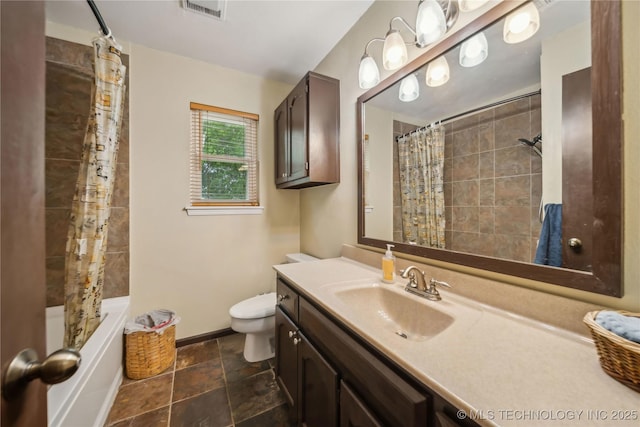full bathroom featuring visible vents, shower / bath combo, baseboards, vanity, and toilet