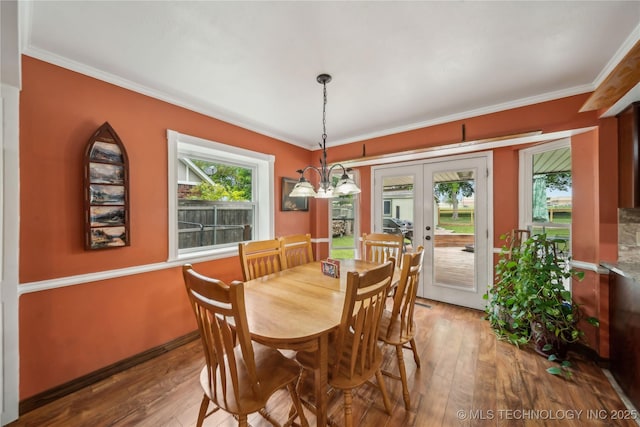 dining area featuring plenty of natural light, hardwood / wood-style floors, and french doors