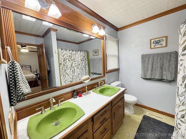full bath featuring crown molding, visible vents, and a sink