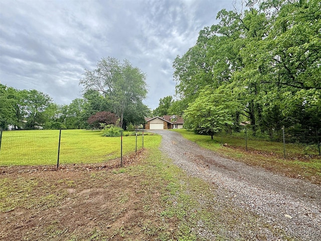 view of street featuring gravel driveway