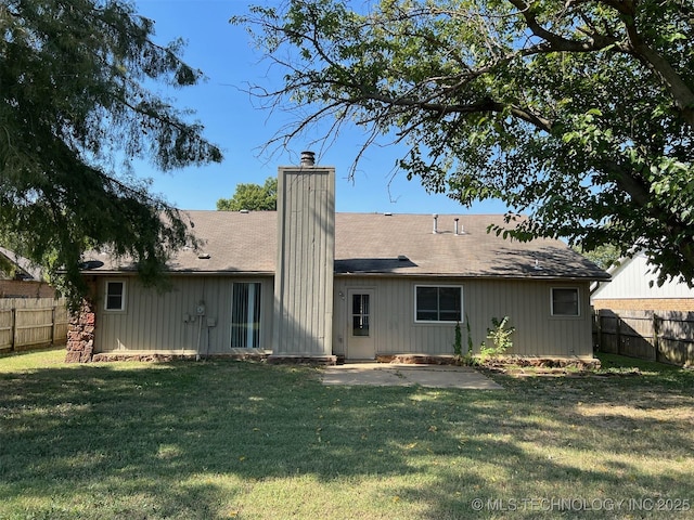 1209 S 29th St, Broken Arrow, OK 74014 - back of house with a patio, a fenced backyard, a yard, and a chimney