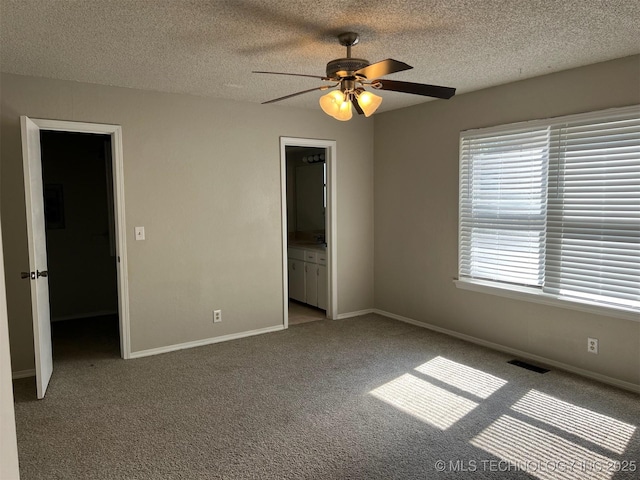 1209 S 29th St, Broken Arrow, OK 74014 - unfurnished bedroom with baseboards, carpet flooring, a textured ceiling, and visible vents