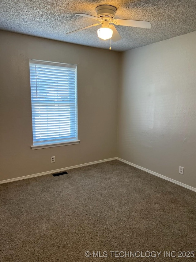 1209 S 29th St, Broken Arrow, OK 74014 - carpeted spare room featuring baseboards, a ceiling fan, a textured ceiling, and visible vents
