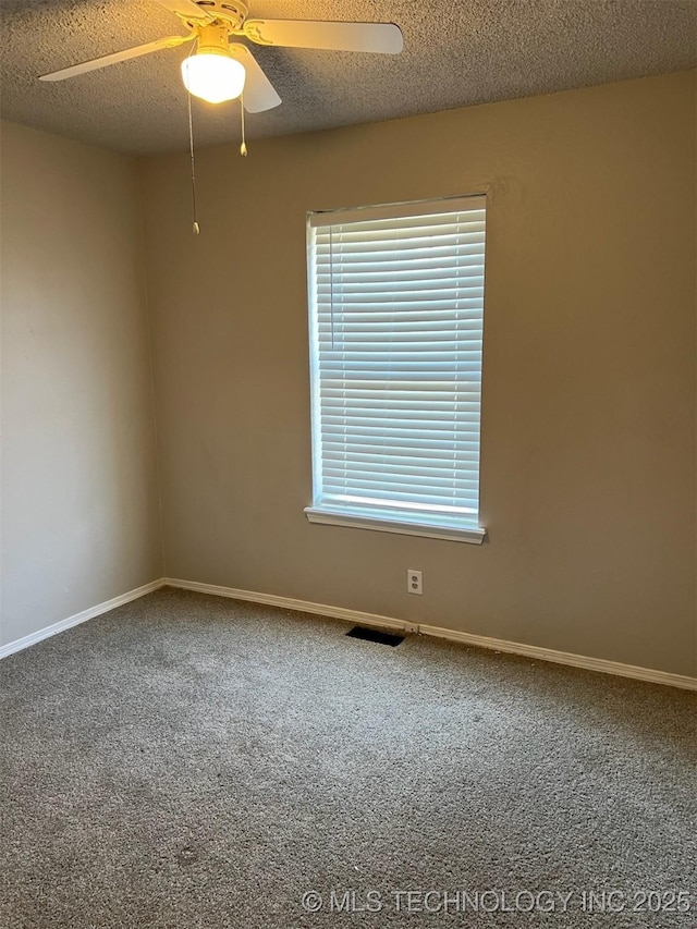 1209 S 29th St, Broken Arrow, OK 74014 - unfurnished room featuring carpet floors, a ceiling fan, a textured ceiling, and baseboards