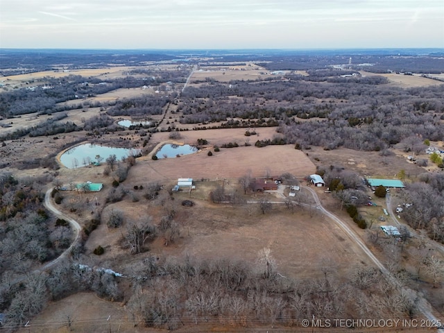 birds eye view of property featuring a rural view