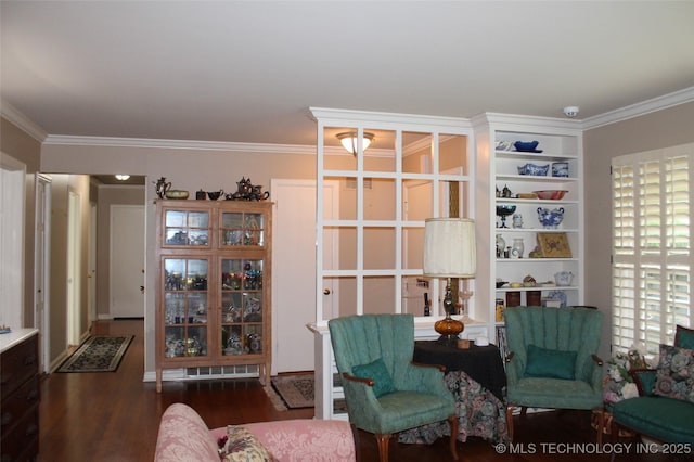 living area with ornamental molding and wood finished floors