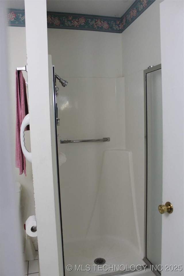bathroom featuring a stall shower