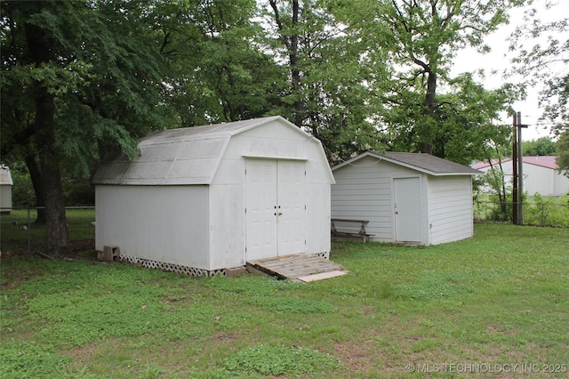 view of shed with fence