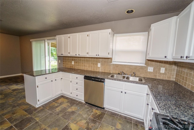 1160 S 124th E Ave, Tulsa, OK 74128 - kitchen featuring appliances with stainless steel finishes, a sink, a peninsula, white cabinetry, and a textured ceiling