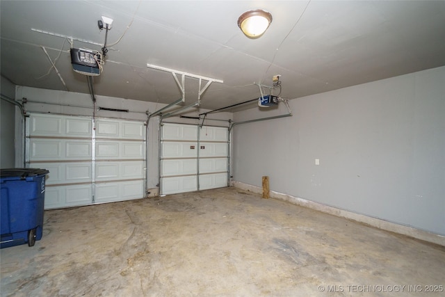 1160 S 124th E Ave, Tulsa, OK 74128 - garage featuring a garage door opener and baseboards