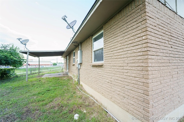 1160 S 124th E Ave, Tulsa, OK 74128 - view of home's exterior featuring brick siding and a lawn