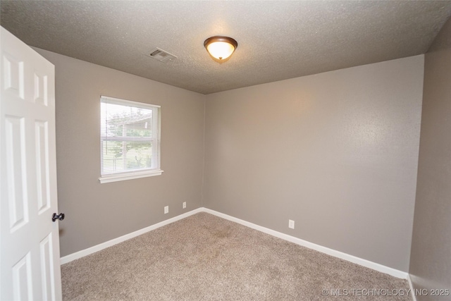 1160 S 124th E Ave, Tulsa, OK 74128 - carpeted empty room featuring baseboards and a textured ceiling