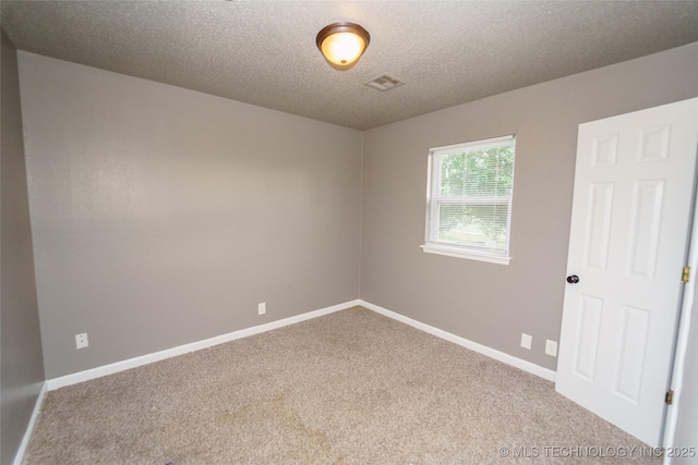 1160 S 124th E Ave, Tulsa, OK 74128 - carpeted spare room with a textured ceiling and baseboards
