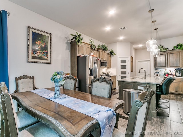 6342 E 148th St S, Bixby, OK 74008 - dining area featuring light wood-type flooring and recessed lighting