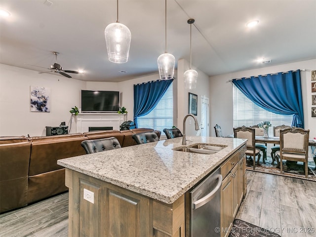 6342 E 148th St S, Bixby, OK 74008 - kitchen featuring a sink, stainless steel dishwasher, healthy amount of natural light, and light wood-type flooring