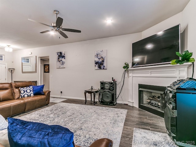 6342 E 148th St S, Bixby, OK 74008 - living area featuring dark wood-type flooring, ceiling fan, a fireplace, and baseboards