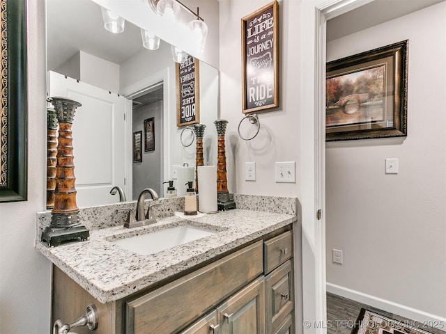 6342 E 148th St S, Bixby, OK 74008 - bathroom featuring vanity, wood finished floors, and baseboards