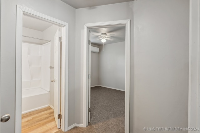 corridor featuring baseboards