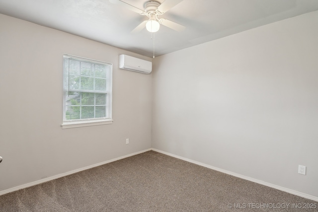 spare room with carpet floors, ceiling fan, a wall unit AC, and baseboards