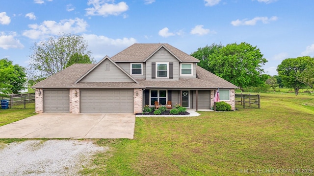 view of front facade featuring fence, a shingled roof, a porch, a front yard, and driveway