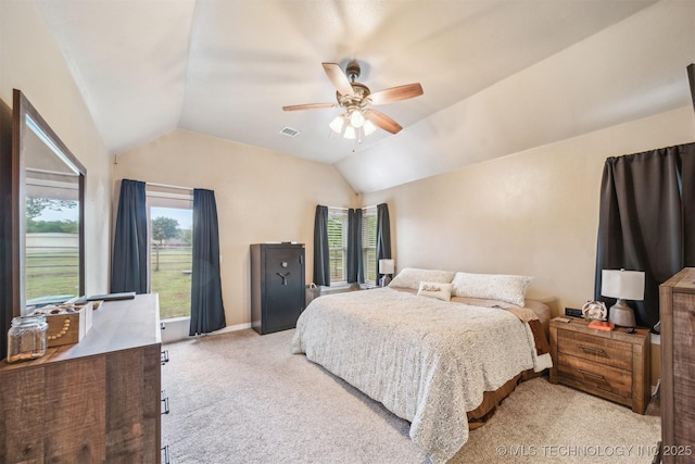 carpeted bedroom with visible vents, baseboards, ceiling fan, and lofted ceiling