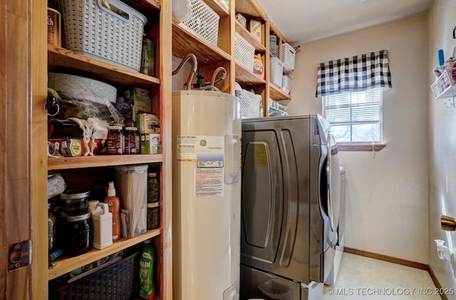 laundry room featuring baseboards, laundry area, and washer and dryer