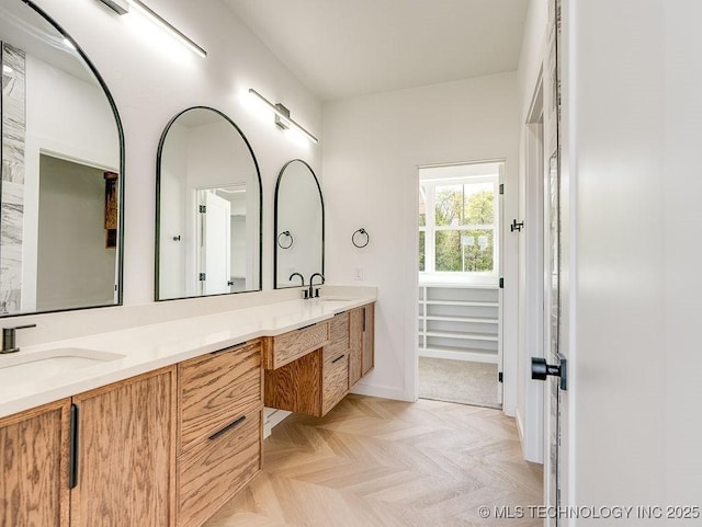 full bathroom featuring double vanity and a sink