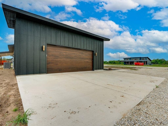 detached garage featuring cooling unit