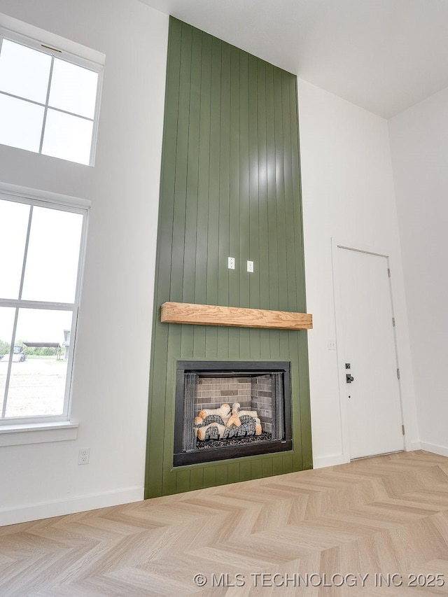 interior space with a healthy amount of sunlight and a large fireplace