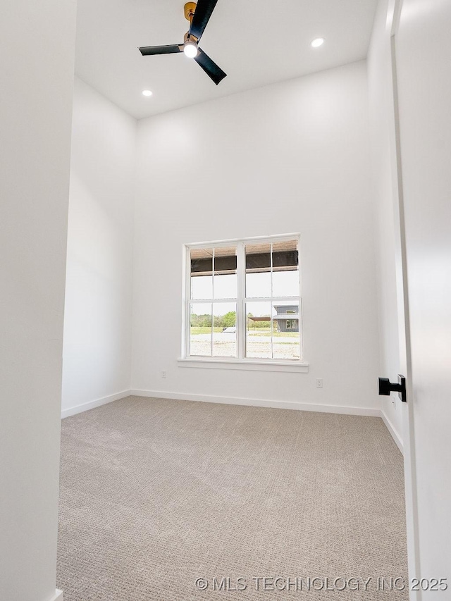 unfurnished room with carpet floors, ceiling fan, baseboards, and recessed lighting