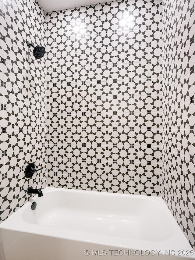 full bathroom featuring a bathtub and a shower