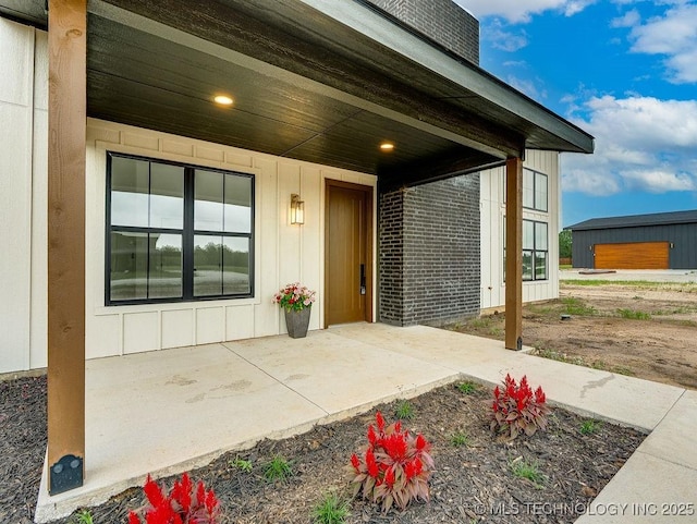 entrance to property featuring board and batten siding