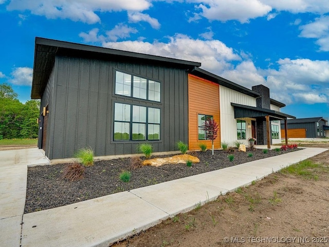 view of side of home featuring board and batten siding