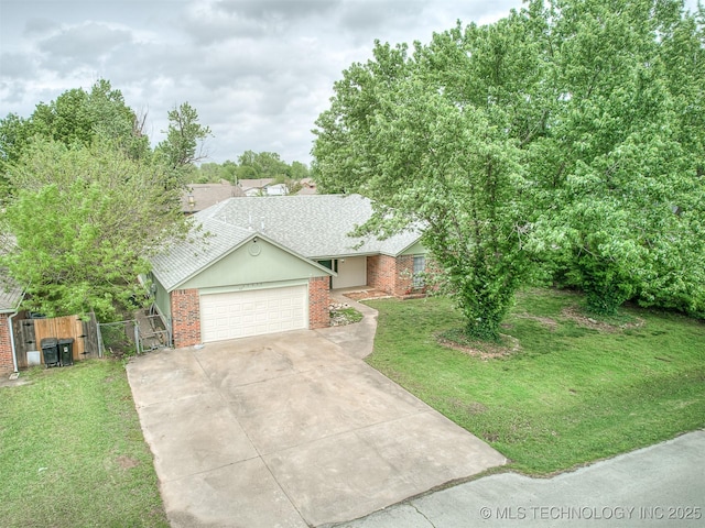 ranch-style house featuring driveway, a garage, brick siding, fence, and a front lawn
