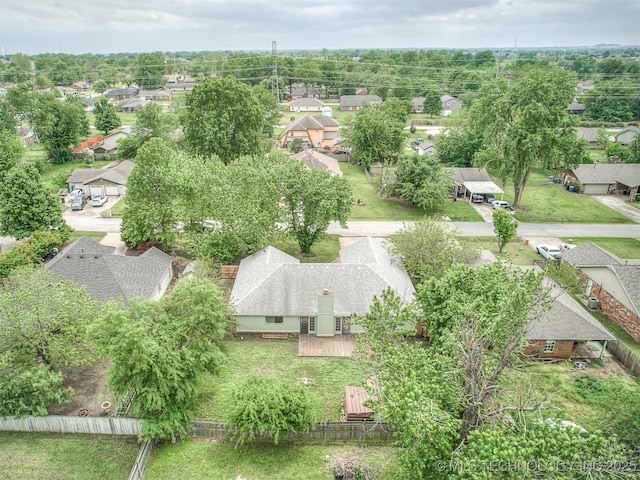 birds eye view of property with a residential view
