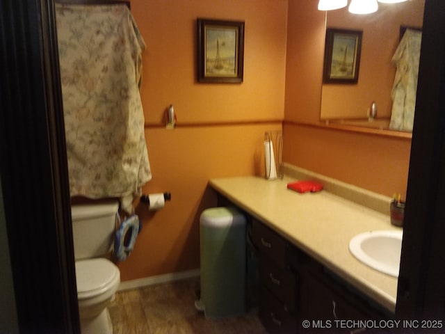 1324 E Hickory St, Okmulgee, OK 74447 - bathroom featuring vanity and toilet