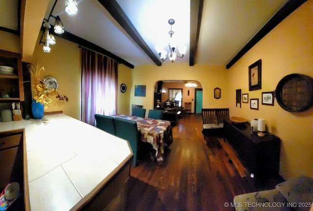 1324 E Hickory St, Okmulgee, OK 74447 - bedroom with arched walkways, beam ceiling, and wood finished floors