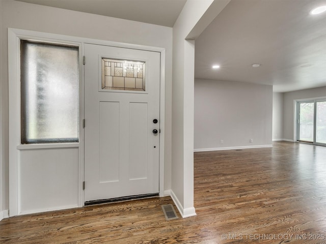 entrance foyer featuring recessed lighting, baseboards, visible vents, and wood finished floors
