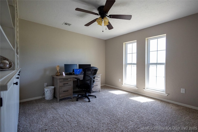home office with baseboards, a wealth of natural light, and carpet
