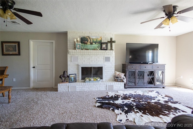 living area with carpet flooring, a ceiling fan, baseboards, and a fireplace