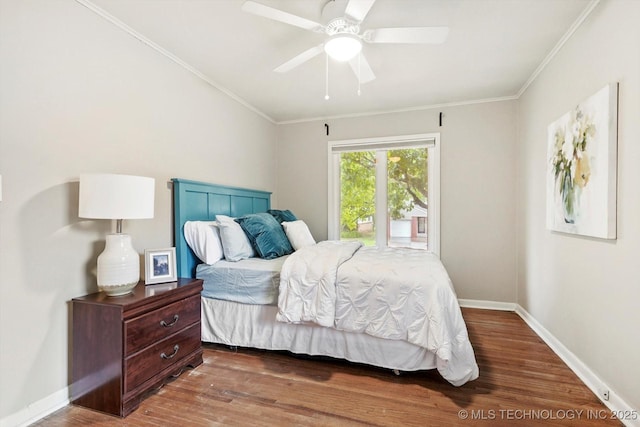 bedroom featuring ceiling fan, baseboards, ornamental molding, and wood finished floors