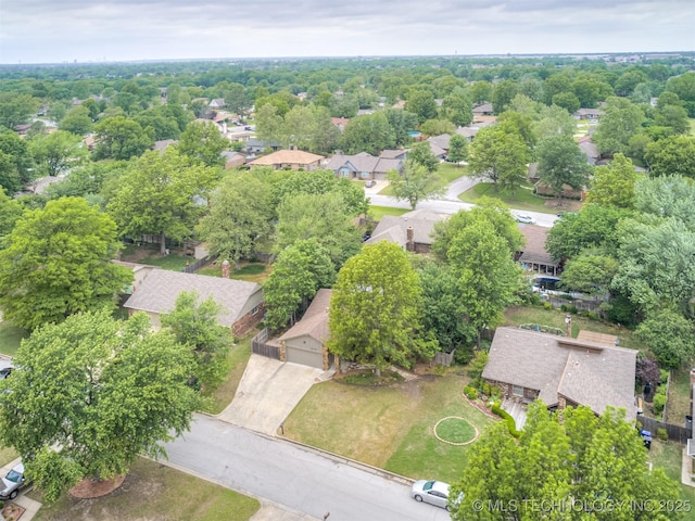 birds eye view of property with a residential view