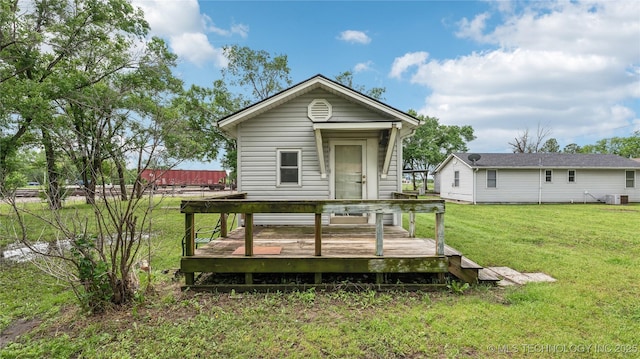 25505 S 4111th Rd, Claremore, OK 74019 - back of property featuring a lawn, central AC unit, and a deck