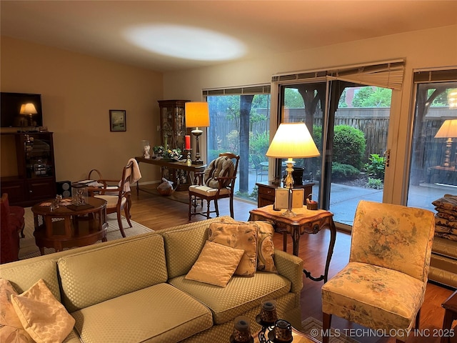 2124 E 60th Ct Unit O-4, Tulsa, OK 74105 - living room with wood finished floors and healthy amount of natural light