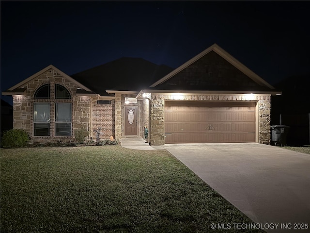 single story home featuring a yard, driveway, and stone siding