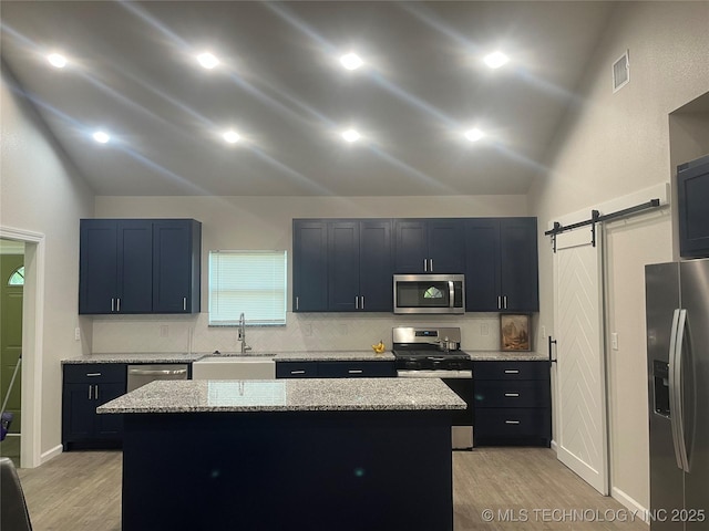 5114 W 3rd St, Tulsa, OK 74127 - kitchen featuring a sink, appliances with stainless steel finishes, light wood finished floors, and lofted ceiling
