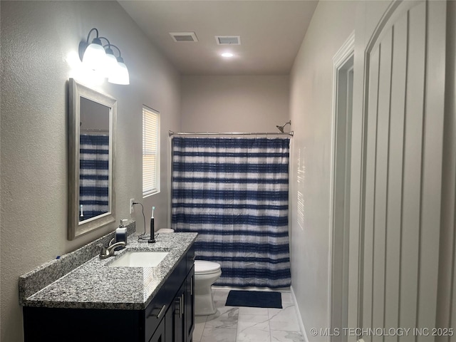 5114 W 3rd St, Tulsa, OK 74127 - full bathroom featuring visible vents, marble finish floor, toilet, and vanity